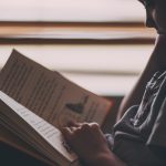 Traveling Tips: The Best Books for Kids Child reading by andrew branch 180244 e1504640991404