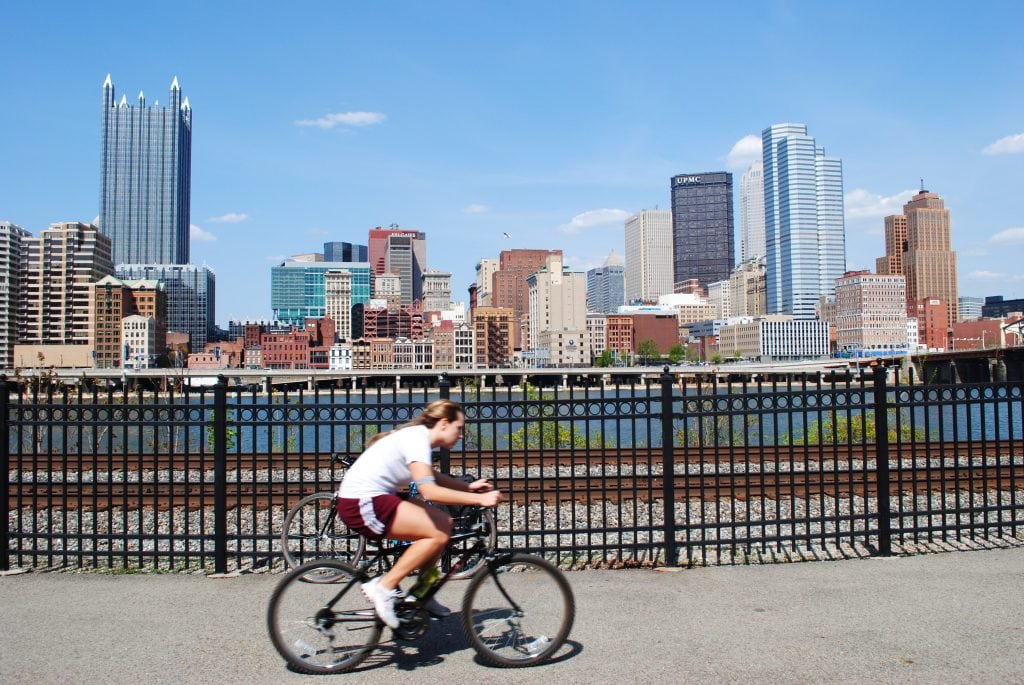 Person Riding a Bike Through Pittsburgh